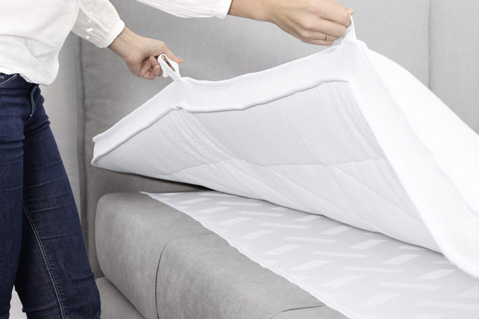 Topper auf einem Boxspringbett